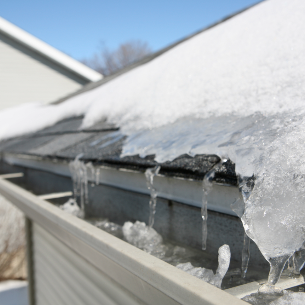 Ice dam formation on a snowy roof